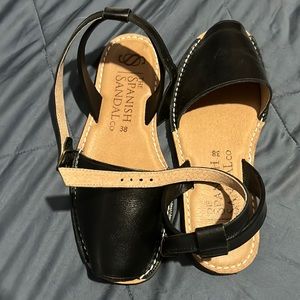 Black leather sandals with ankle strap